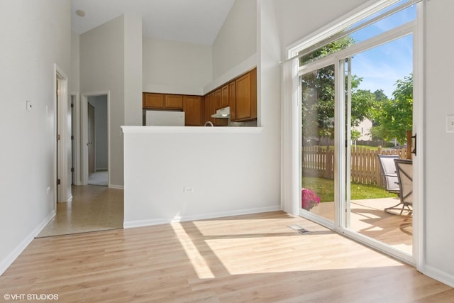 2715 Hoffman St, Plano, IL 60545 - doorway with light wood-style floors and a towering ceiling