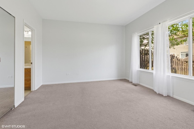 2715 Hoffman St, Plano, IL 60545 - unfurnished room with light carpet and baseboards