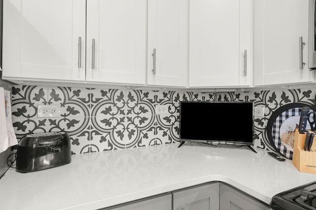 2406 Georgetown Cir, Aurora, IL 60503 - detailed view of light countertops, tasteful backsplash, and white cabinetry