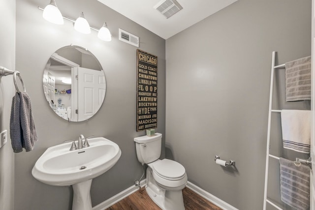 2406 Georgetown Cir, Aurora, IL 60503 - half bathroom with wood finished floors and toilet
