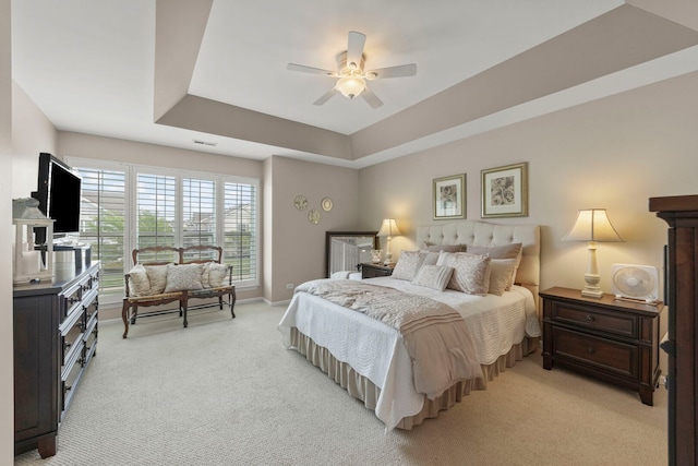 2406 Georgetown Cir, Aurora, IL 60503 - bedroom featuring light colored carpet, a raised ceiling, and a ceiling fan