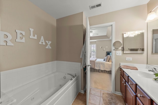2406 Georgetown Cir, Aurora, IL 60503 - ensuite bathroom with vanity, a whirlpool tub, tile patterned floors, and a ceiling fan