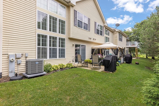 2406 Georgetown Cir, Aurora, IL 60503 - back of house featuring a patio, a yard, and a gazebo