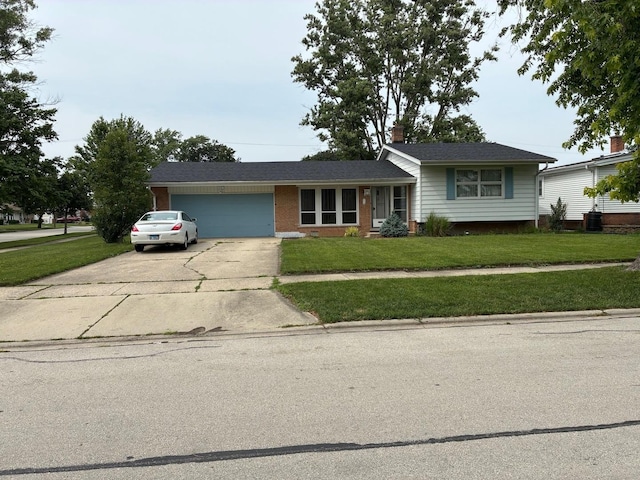10 Lombard Cir, Lombard, IL 60148 - tri-level home with a front yard, concrete driveway, an attached garage, and a chimney