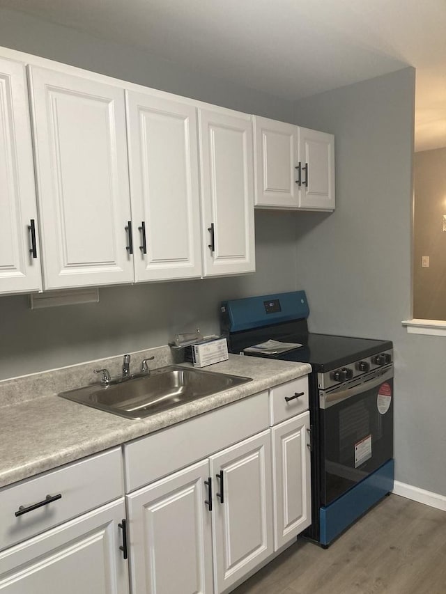 6300 N Sheridan Rd Unit 517, Chicago, IL 60660 - kitchen with stainless steel range with electric cooktop, white cabinetry, and light wood-style floors