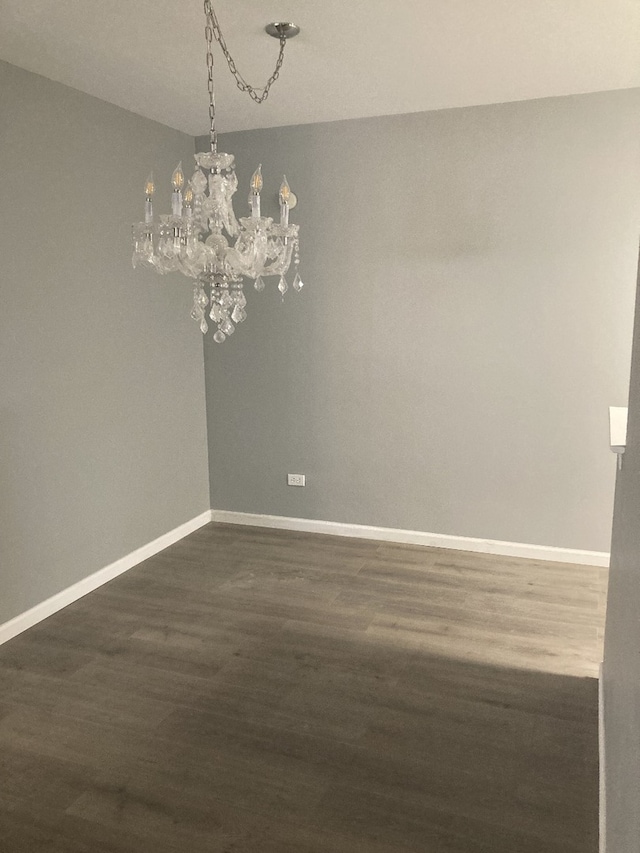 6300 N Sheridan Rd Unit 517, Chicago, IL 60660 - unfurnished room featuring a chandelier and dark wood finished floors
