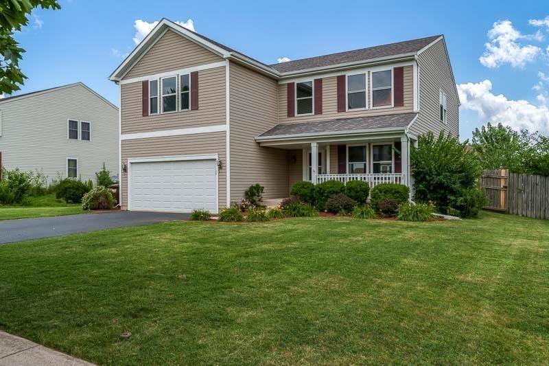 532 Prairie Point Dr, Poplar Grove, IL 61065 - traditional-style house featuring a garage, covered porch, and driveway
