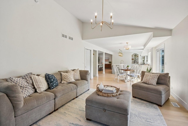 0N467 Cloos Ct, Winfield, IL 60190 - living room with a chandelier, light wood-style floors, and vaulted ceiling
