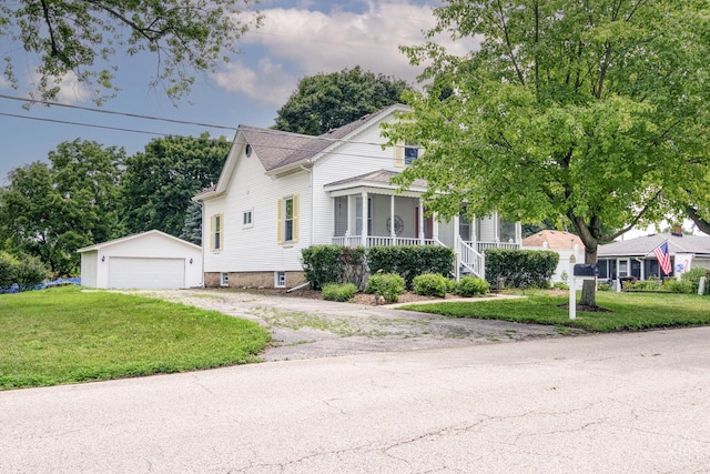 275 N Main St, Crystal Lake, IL 60014 - view of front of house with an outbuilding, a garage, a front yard, and covered porch