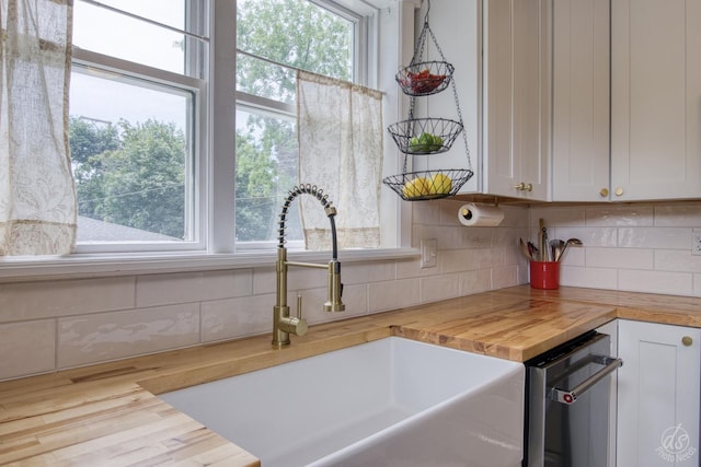 275 N Main St, Crystal Lake, IL 60014 - kitchen featuring wooden counters, decorative backsplash, and plenty of natural light