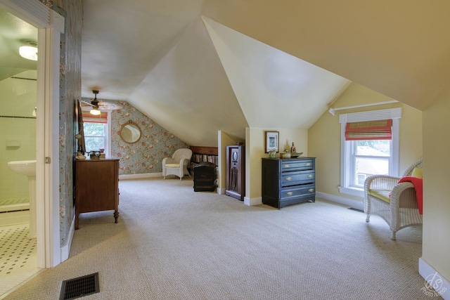 275 N Main St, Crystal Lake, IL 60014 - carpeted bedroom with vaulted ceiling, ensuite bathroom, and wallpapered walls