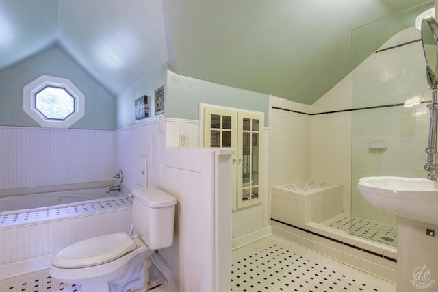 275 N Main St, Crystal Lake, IL 60014 - full bath featuring vaulted ceiling, a bath, wainscoting, and a tile shower