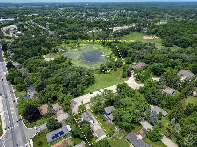 275 N Main St, Crystal Lake, IL 60014 - aerial view of property and surrounding area with property boundaries highlighted, a nearby body of water, and nearby suburban area