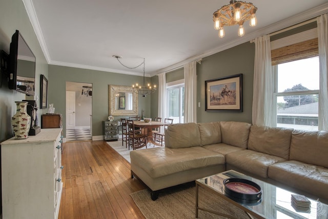275 N Main St, Crystal Lake, IL 60014 - living area with a chandelier, light wood-style floors, and crown molding