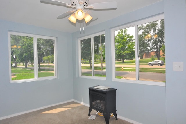1033 S Main Dr, Lombard, IL 60148 - unfurnished sunroom with a wood stove and plenty of natural light