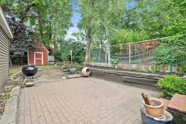 2620 Vermont St, Blue Island, IL 60406 - view of patio featuring a storage shed and grilling area
