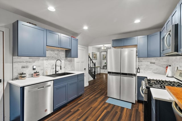 2620 Vermont St, Blue Island, IL 60406 - kitchen with appliances with stainless steel finishes, decorative backsplash, blue cabinets, recessed lighting, and lofted ceiling