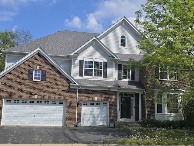 2221 Edgartown Ln, Hoffman Estates, IL 60192 - traditional-style house with driveway, a garage, and brick siding