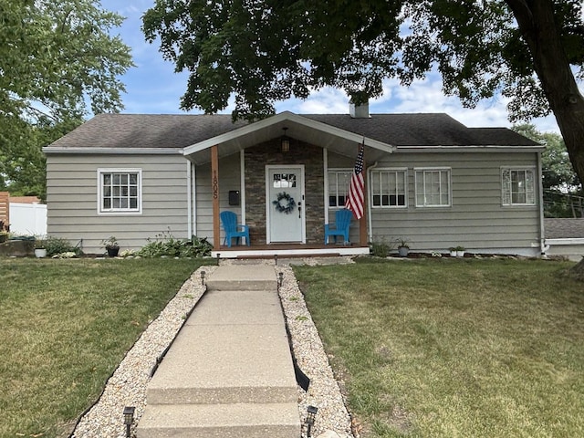 1805 Rock St, Peru, IL 61354 - ranch-style house with a front lawn, a shingled roof, and a porch