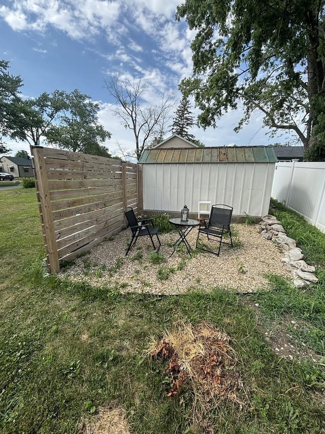 1805 Rock St, Peru, IL 61354 - fenced backyard featuring a storage unit