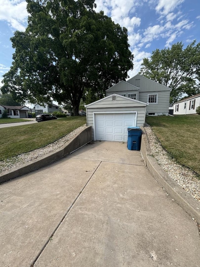 1805 Rock St, Peru, IL 61354 - view of side of home with concrete driveway, an outdoor structure, and a yard
