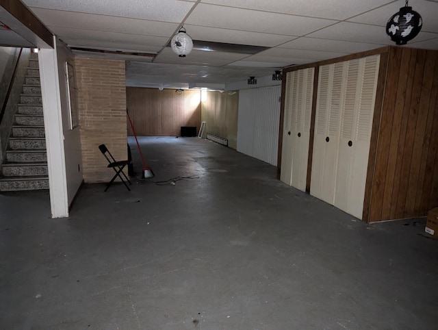 219 W 79th St, Burr Ridge, IL 60527 - finished below grade area with wooden walls, stairway, and a baseboard radiator