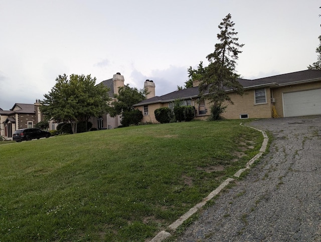 219 W 79th St, Burr Ridge, IL 60527 - ranch-style house featuring driveway, an attached garage, and a front lawn