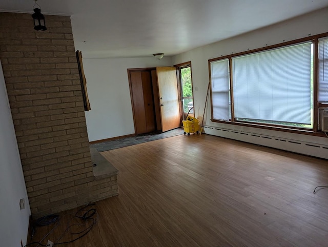 219 W 79th St, Burr Ridge, IL 60527 - empty room featuring wood finished floors and a baseboard radiator