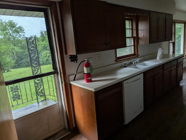 219 W 79th St, Burr Ridge, IL 60527 - kitchen with white dishwasher, light countertops, and decorative backsplash