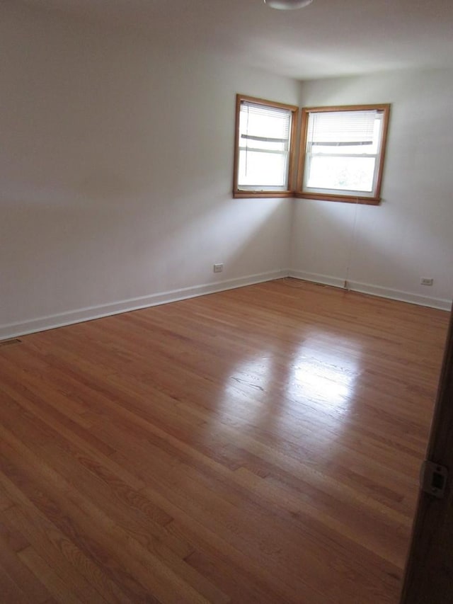 15831 Trumbull Ave, Markham, IL 60428 - spare room with plenty of natural light and wood finished floors