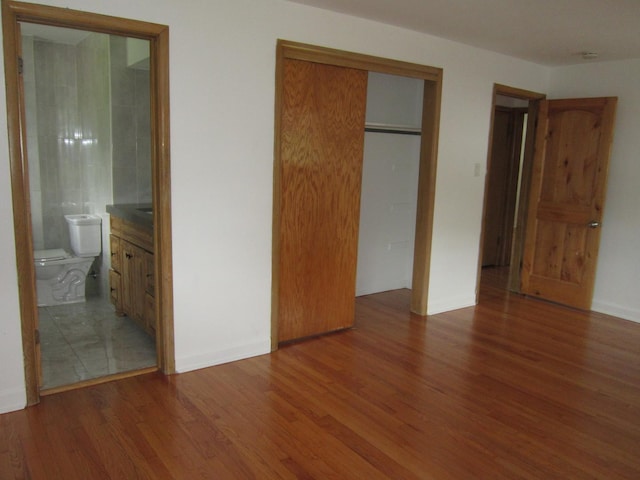 15831 Trumbull Ave, Markham, IL 60428 - unfurnished bedroom with wood finished floors and connected bathroom