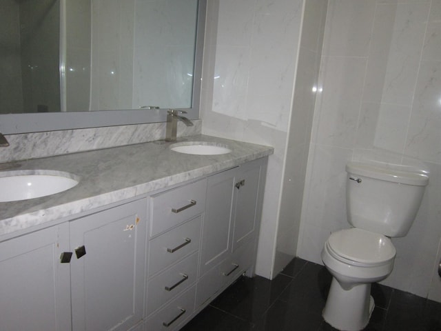 15831 Trumbull Ave, Markham, IL 60428 - bathroom with tile walls, tile patterned floors, and double vanity