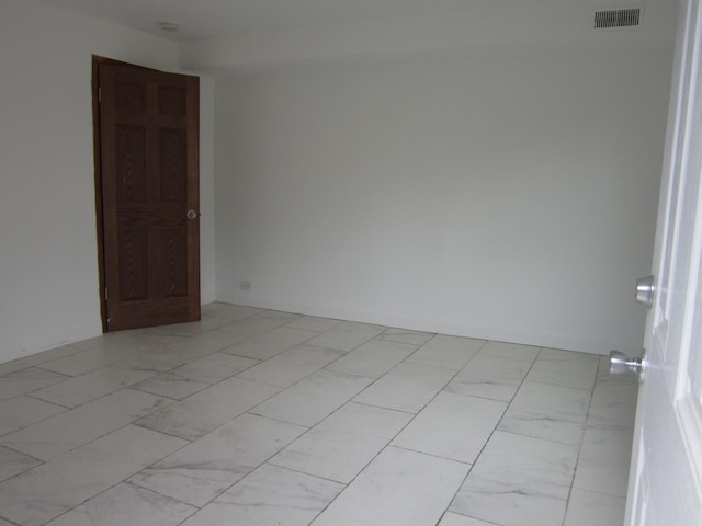 15831 Trumbull Ave, Markham, IL 60428 - unfurnished room featuring light marble finish flooring