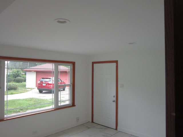 15831 Trumbull Ave, Markham, IL 60428 - spare room featuring healthy amount of natural light and light marble finish floors