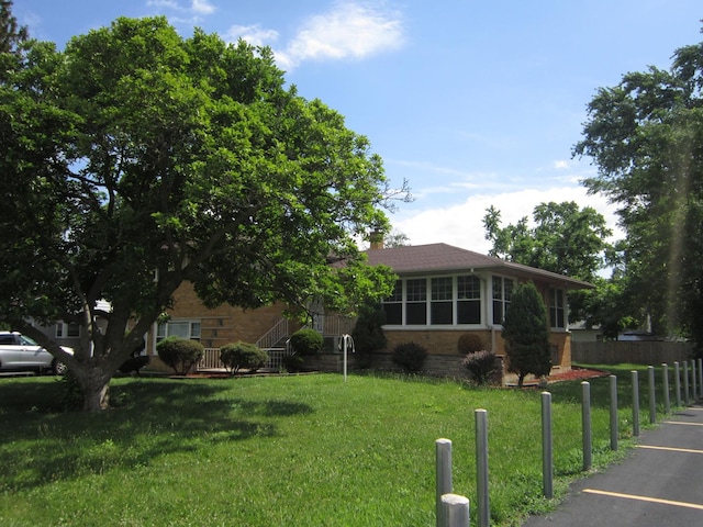15831 Trumbull Ave, Markham, IL 60428 - view of front of house with uncovered parking and brick siding