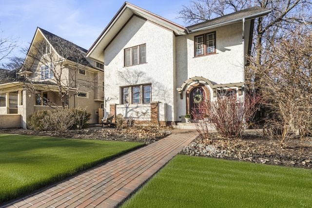 519 N Elmwood Ave, Oak Park, IL 60302 - view of front of house with stucco siding and a front yard