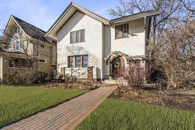 519 N Elmwood Ave, Oak Park, IL 60302 - view of front of house featuring stucco siding and a front yard