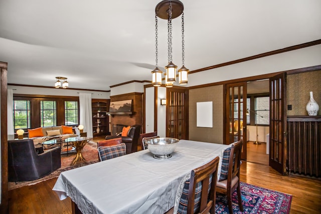 519 N Elmwood Ave, Oak Park, IL 60302 - dining room featuring wood finished floors and ornamental molding