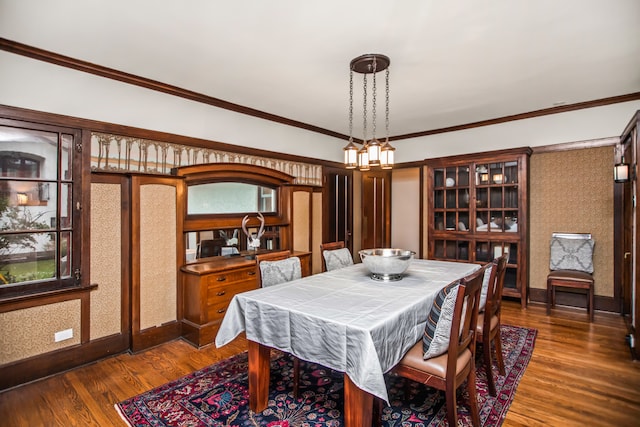 519 N Elmwood Ave, Oak Park, IL 60302 - dining room with dark wood-type flooring, ornamental molding, and a chandelier