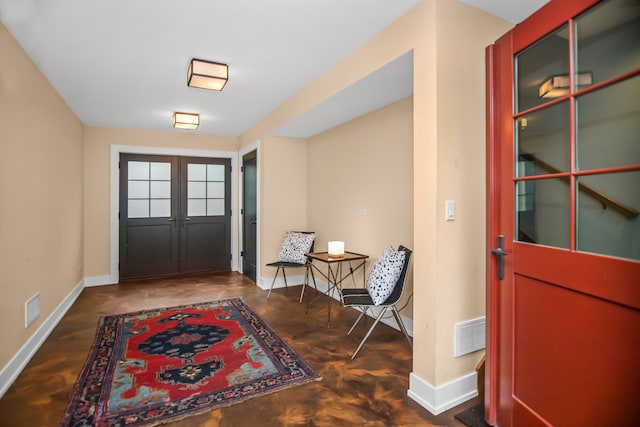 519 N Elmwood Ave, Oak Park, IL 60302 - foyer featuring concrete flooring and french doors