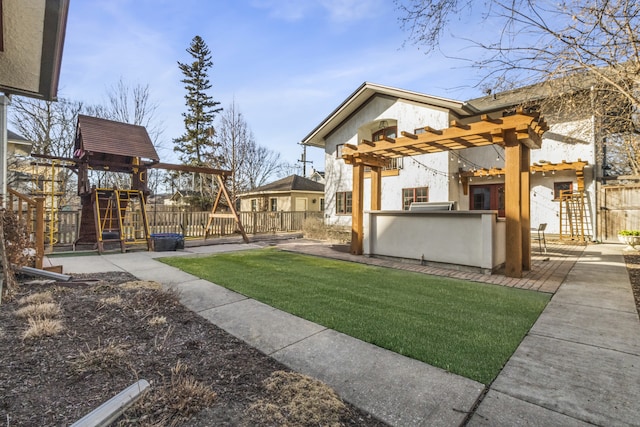 519 N Elmwood Ave, Oak Park, IL 60302 - view of yard with a playground and an outdoor kitchen