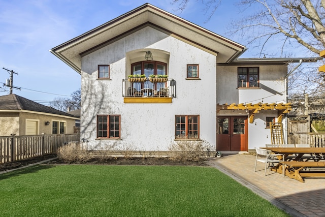 519 N Elmwood Ave, Oak Park, IL 60302 - back of property featuring a balcony, stucco siding, and a patio