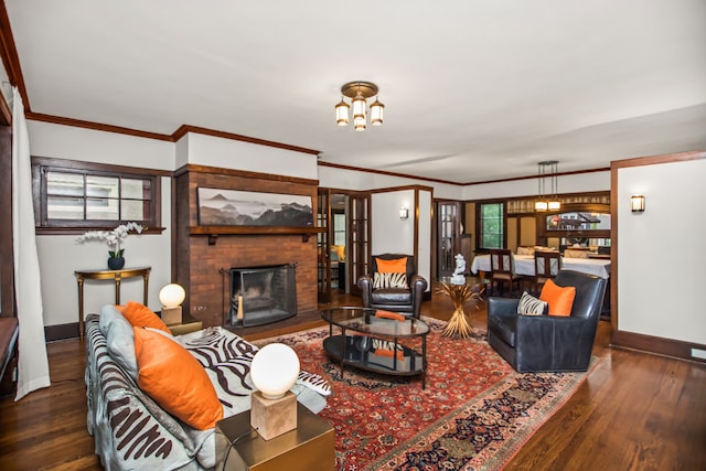 519 N Elmwood Ave, Oak Park, IL 60302 - living area featuring hardwood / wood-style floors, a brick fireplace, crown molding, and a chandelier
