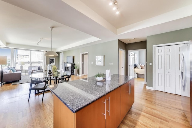 1600 S Wabash Ave Unit 4E, Chicago, IL 60616 - kitchen with track lighting, a kitchen island, open floor plan, light wood-style floors, and a raised ceiling
