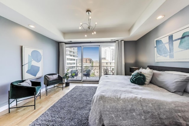 1600 S Wabash Ave Unit 4E, Chicago, IL 60616 - bedroom featuring access to outside, a chandelier, wood finished floors, recessed lighting, and a raised ceiling