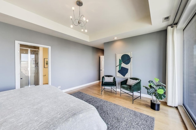 1600 S Wabash Ave Unit 4E, Chicago, IL 60616 - bedroom with wood finished floors, a chandelier, a tray ceiling, and recessed lighting