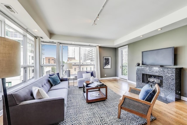 1600 S Wabash Ave Unit 4E, Chicago, IL 60616 - living room with wood finished floors, plenty of natural light, a fireplace, rail lighting, and recessed lighting