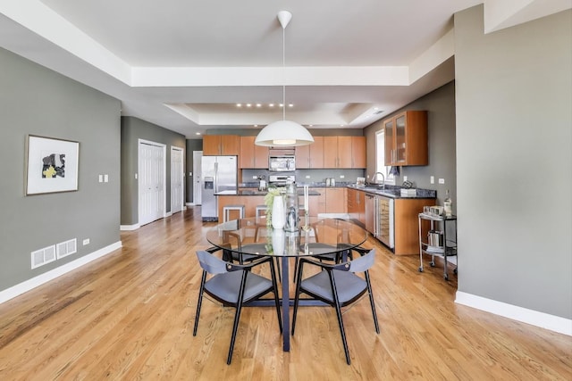 1600 S Wabash Ave Unit 4E, Chicago, IL 60616 - dining space with a raised ceiling and light wood-style flooring