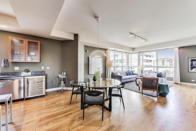 1600 S Wabash Ave Unit 4E, Chicago, IL 60616 - dining space with wine cooler, track lighting, and light wood finished floors