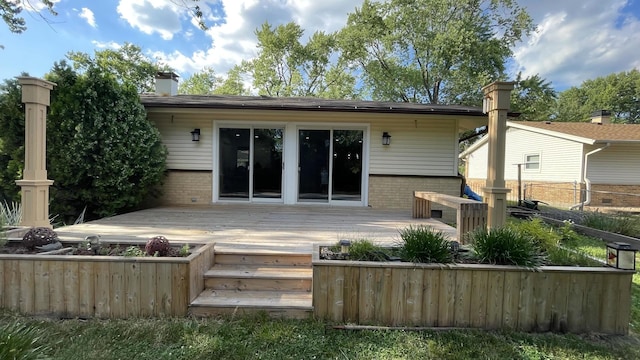 513 Laurel St, Elk Grove Village, IL 60007 - rear view of property with brick siding, a deck, and a chimney